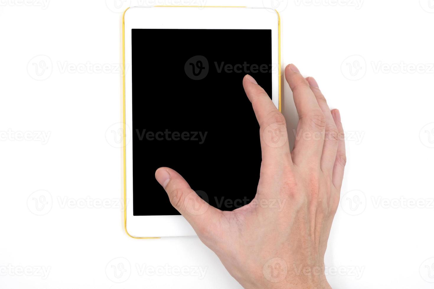 Male hand with a white tablet touch computer gadget with touch blank black screen on white background. photo