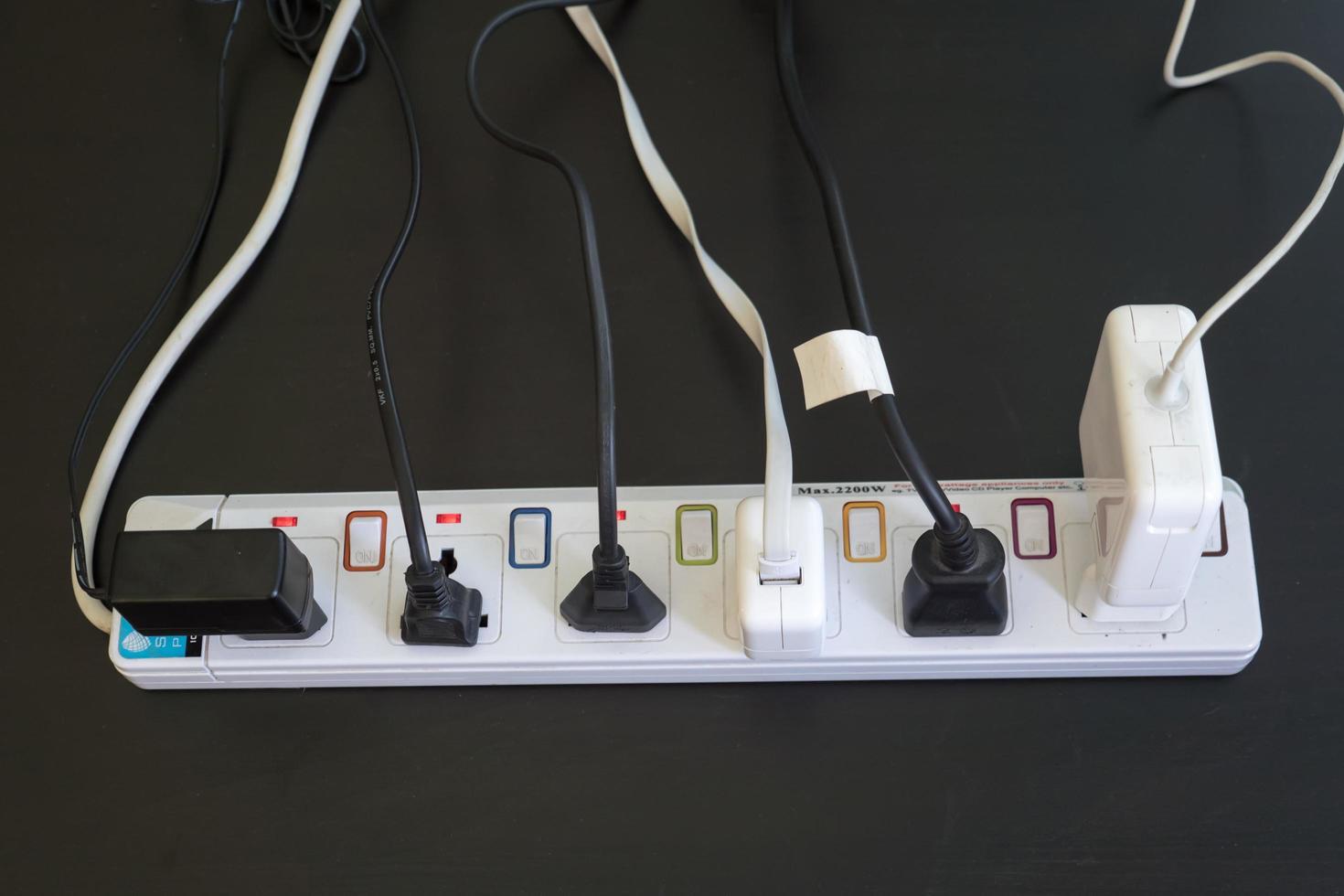 Multiple socket with connected plugs. photo