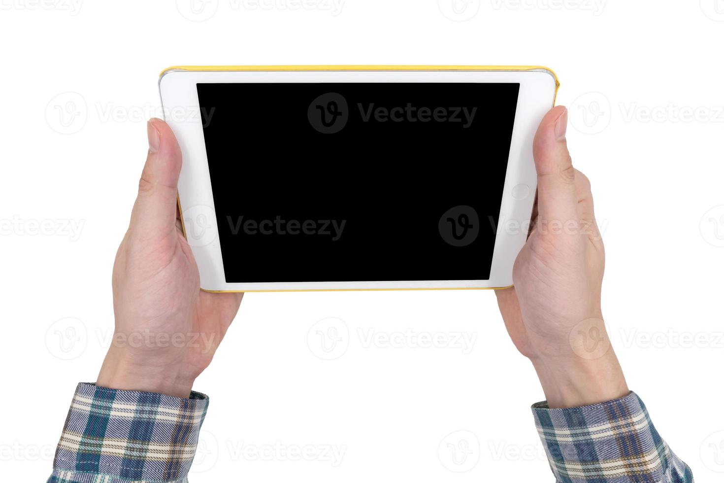 Male hands holding a white tablet touch computer gadget with touch blank black screen isolated on white background. photo