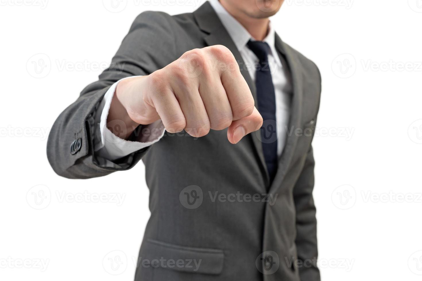 businessman holding his fist in front of him isolated on white background. business struggle photo