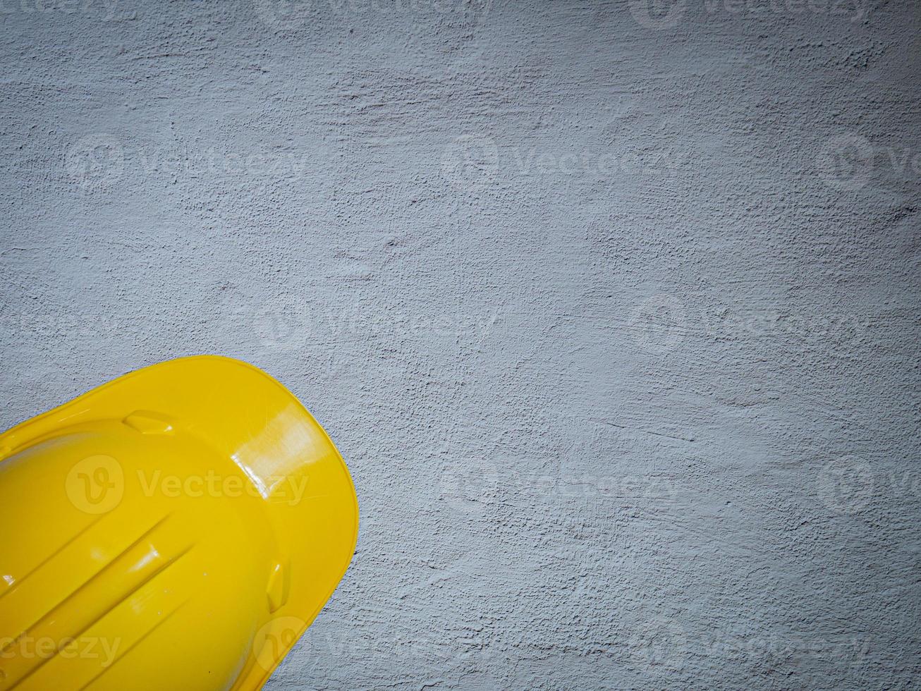 Hard Hats Yellow Cap Mine Safety Appliances on  cement floor photo