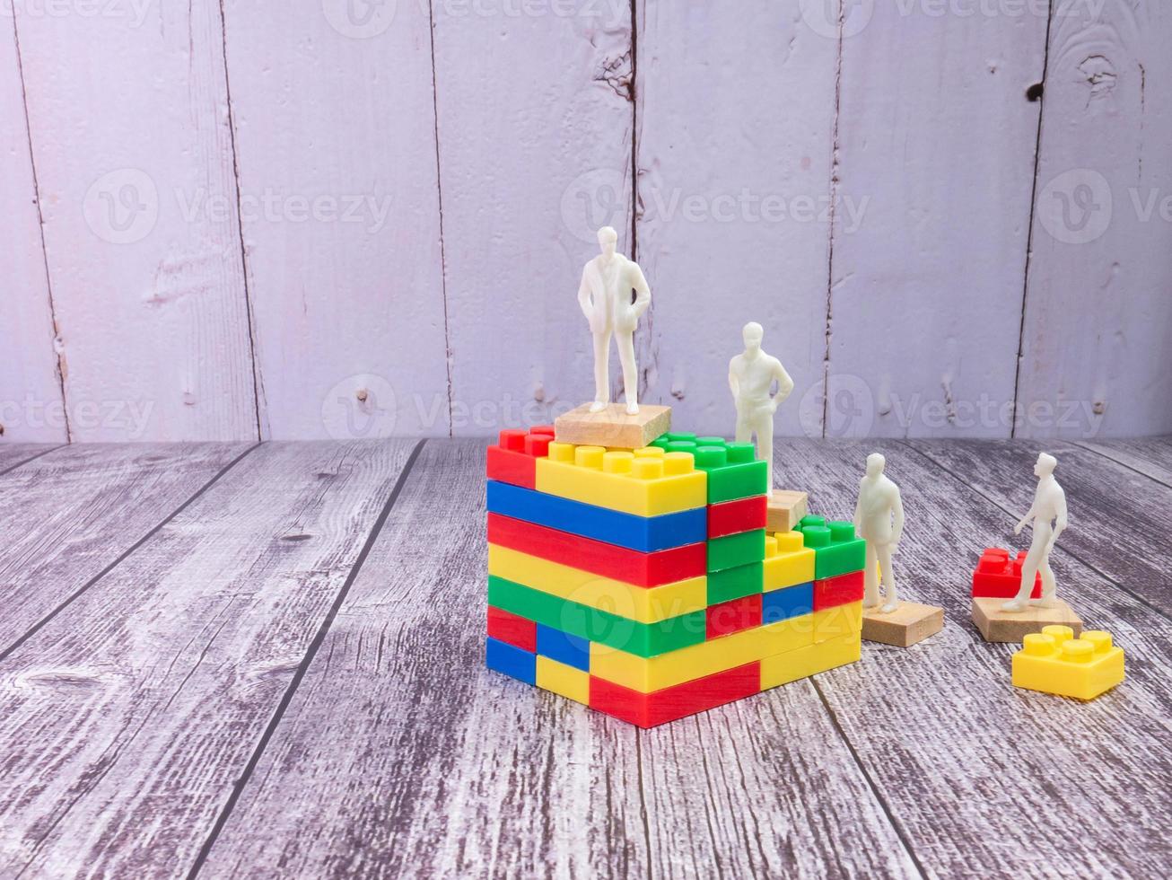 business figure and puzzle block multicolour  for strategy concept photo