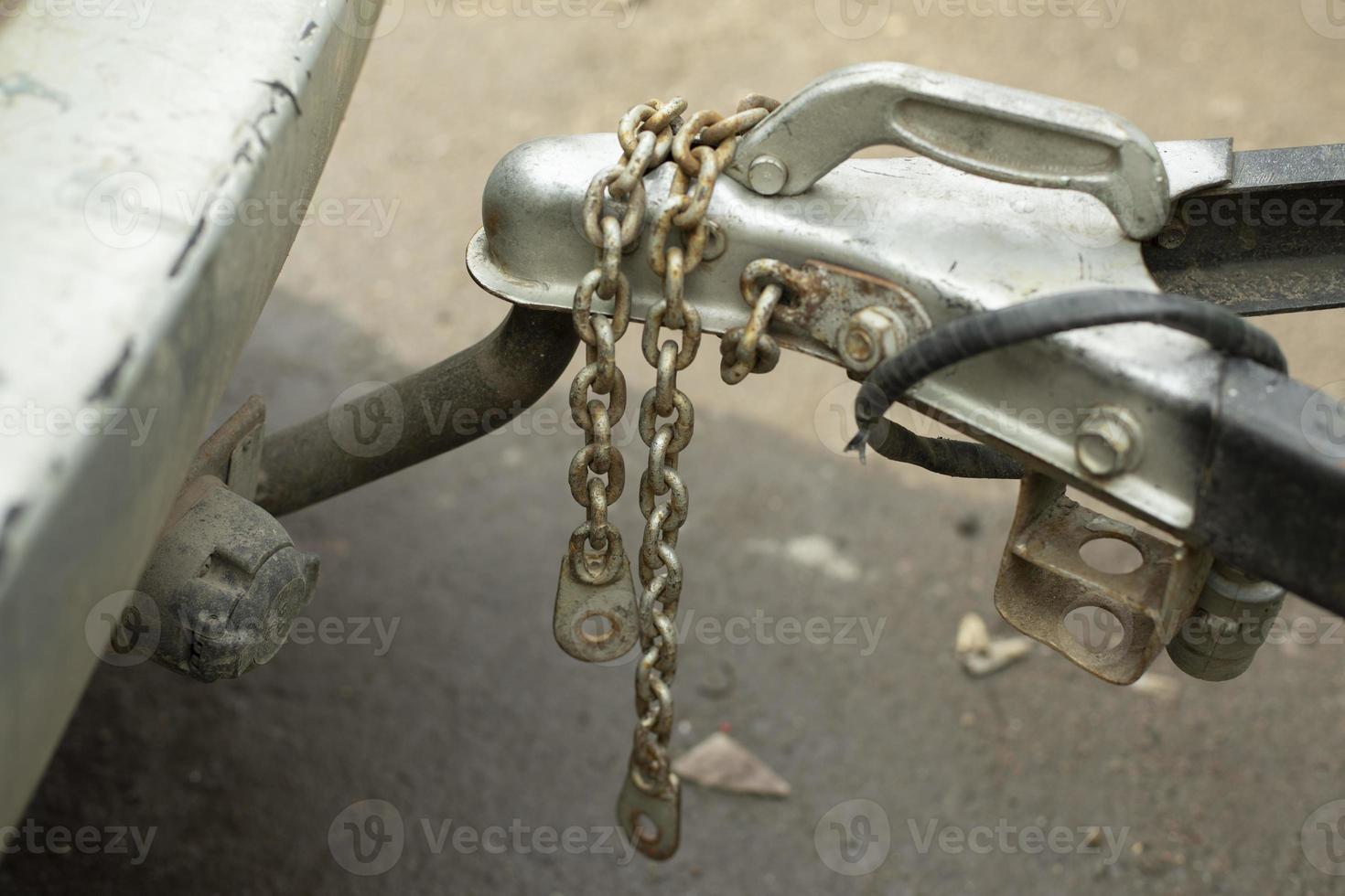 Superstition of trailer to car. Chain in transport. photo