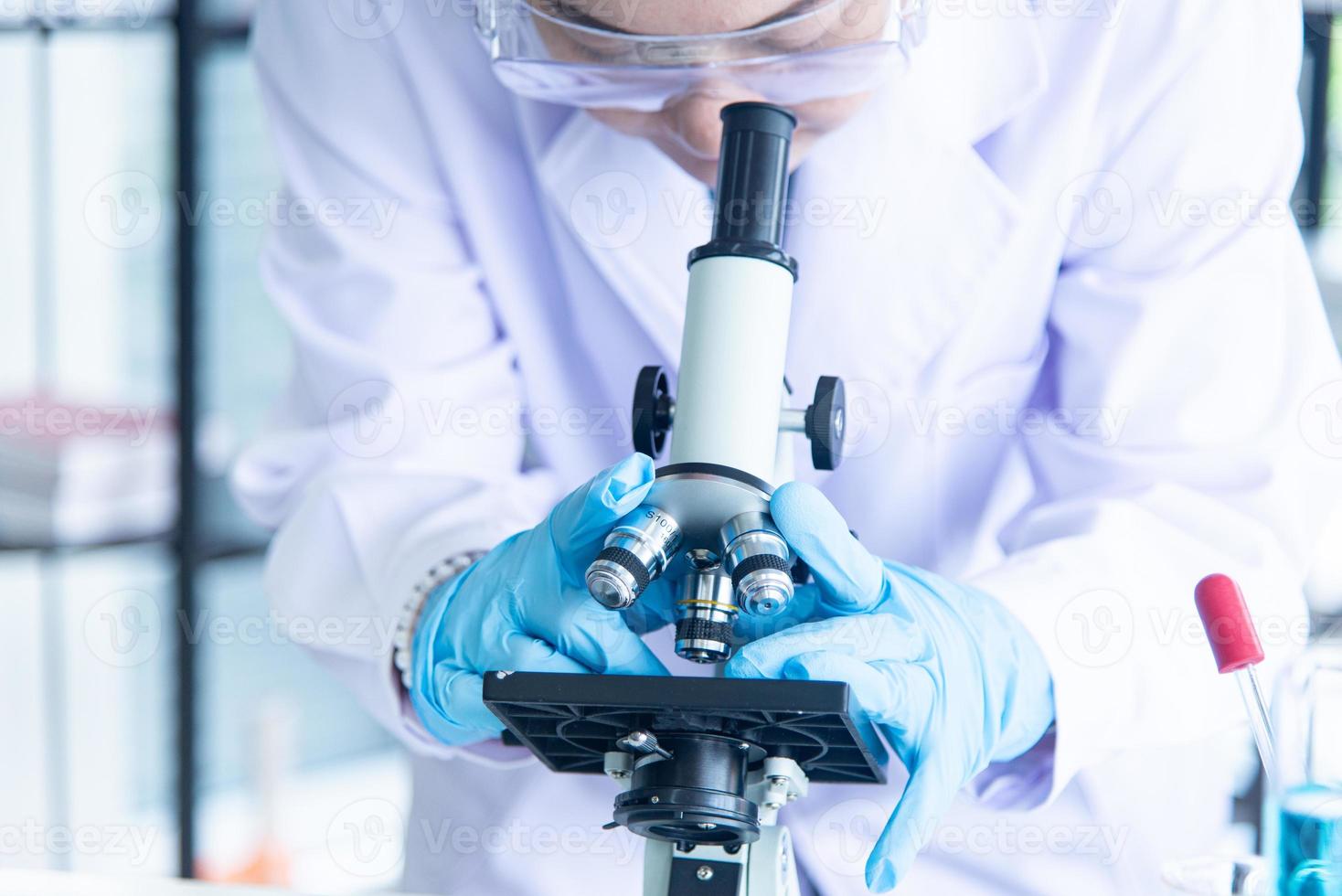 Asian woman scientist, researcher, technician, or student conducted research in laboratory photo