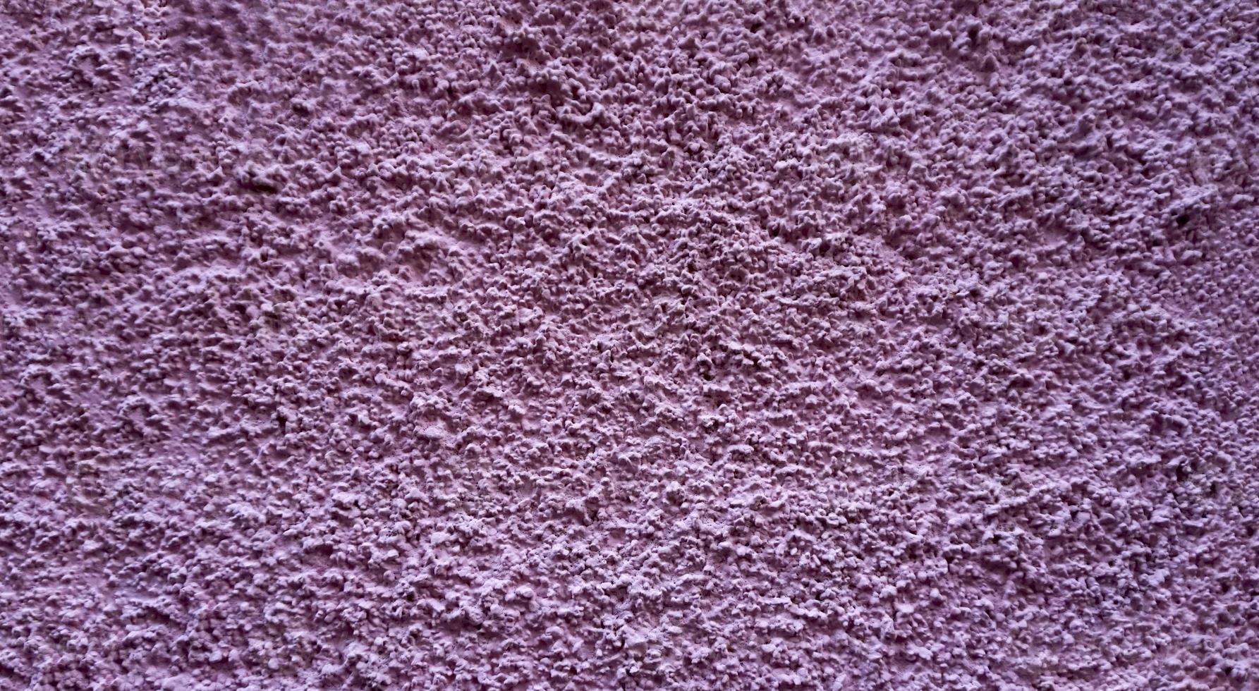 Pink stone grain wall spray painted texture concrete background in retro style with copy space photo