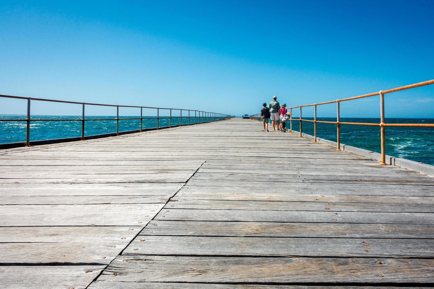 Family Walking on a boardwalk photo