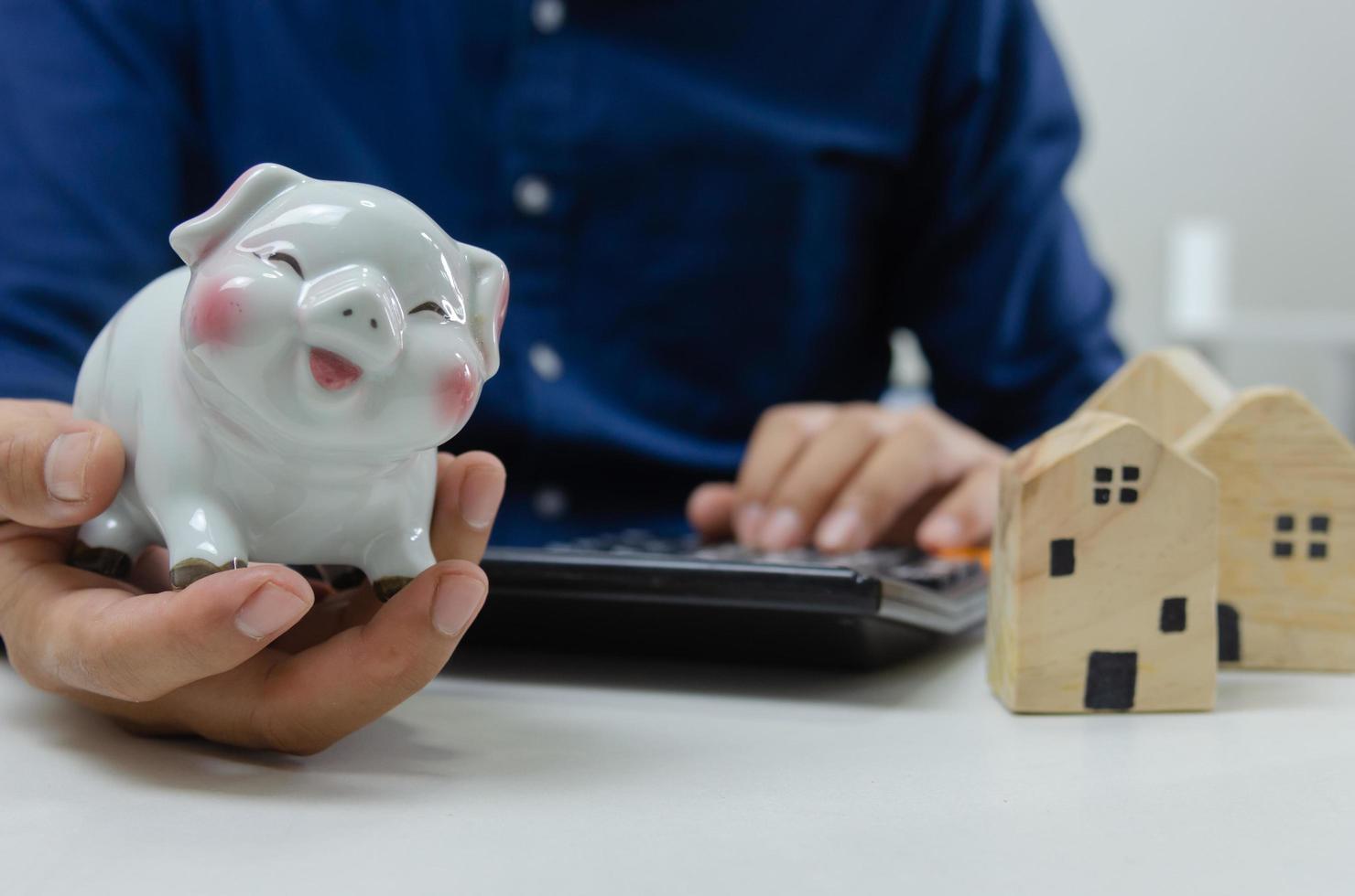 Saving a piggy bank for real estate and housing purchases. Business finance investments taxes or retirement money and concept insurance. photo
