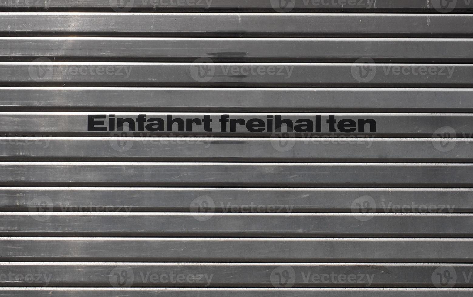 German garage door with text Einfahrt freihalten transl. Keep en photo