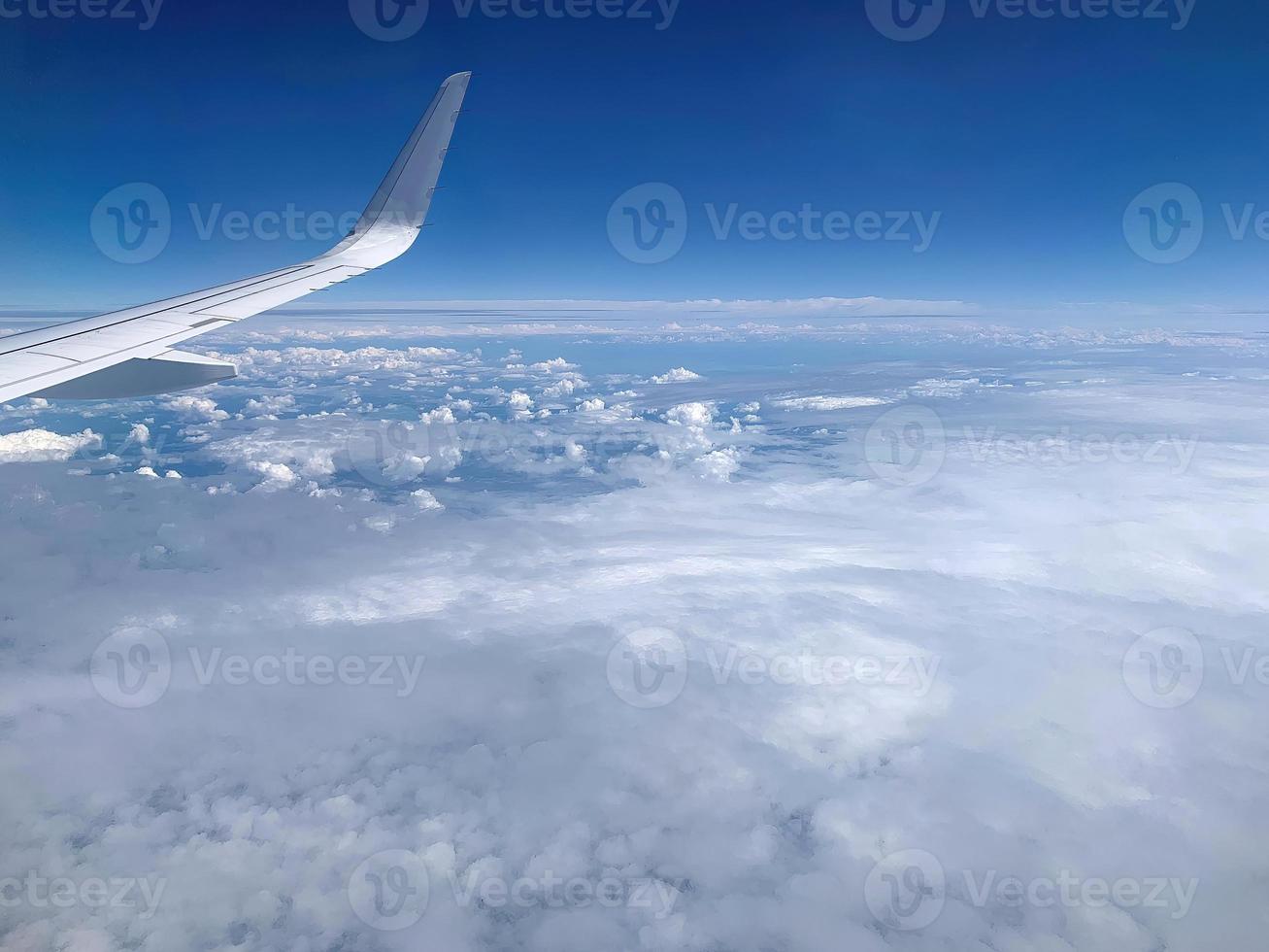 Airplane Window View on Clouds 1 photo