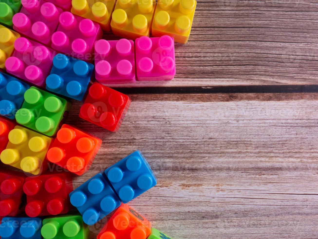 The plastic toy brick on wood table photo