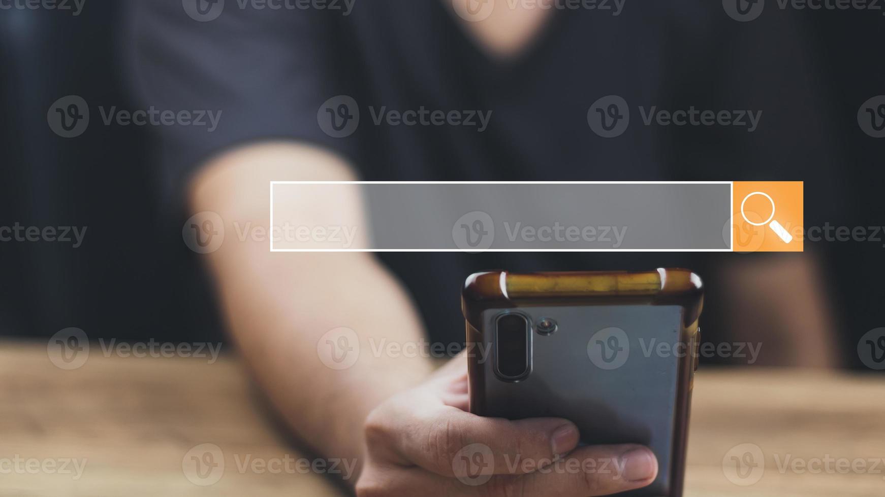 The concept of using technology to search for information, a man's hand is using a smartphone to search for information on social media via the Internet online. photo