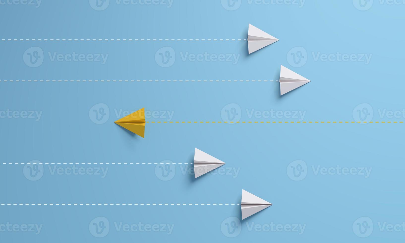 Paper airplane in one direction and with one individual pointing in the different way, leadership, individuality concepts. photo