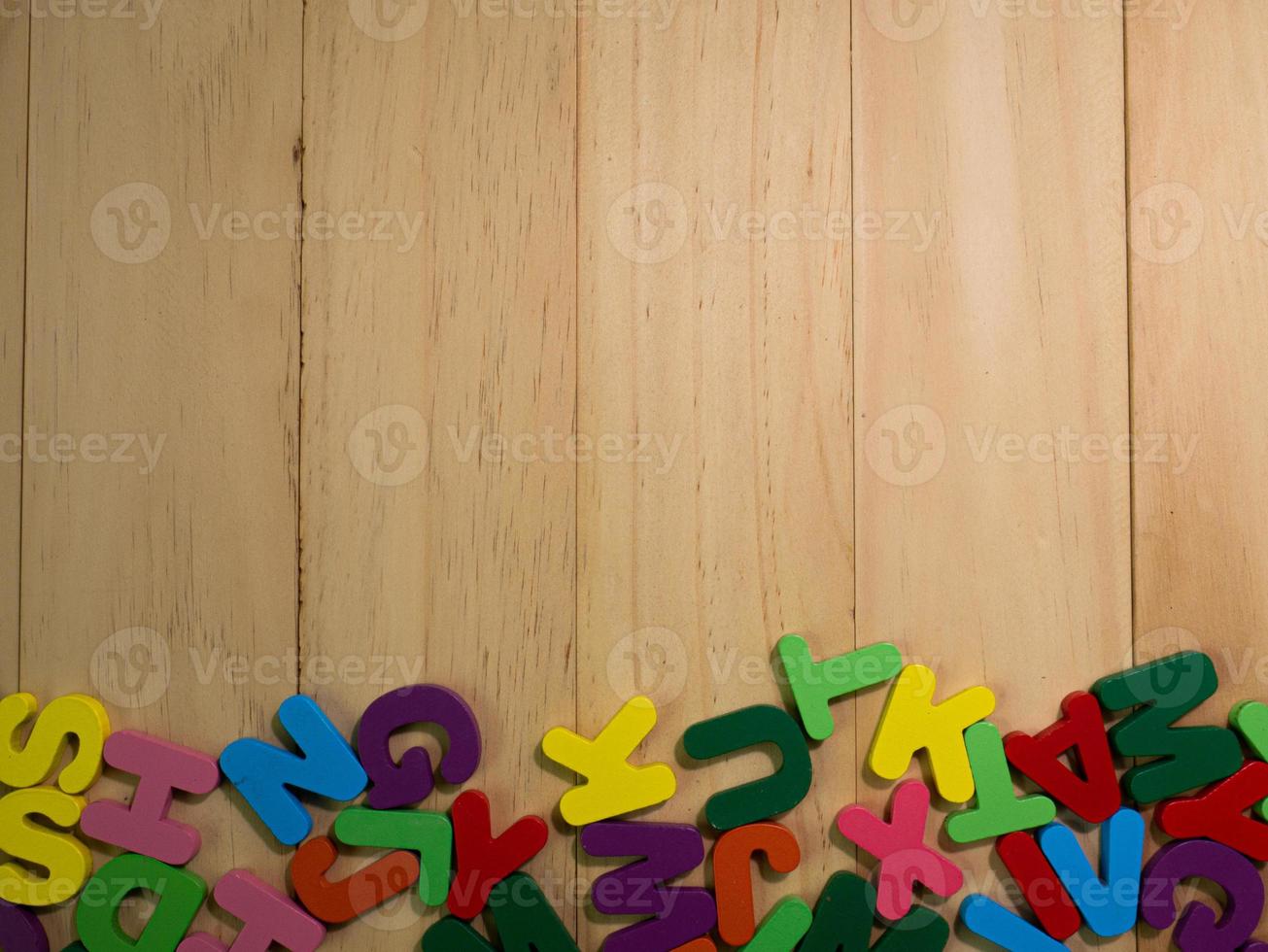 wood alphabet multi color on table for education or kid concept photo