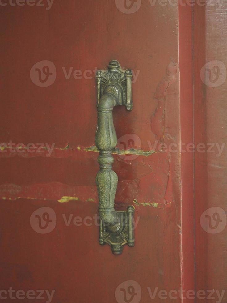 brass handle red door photo