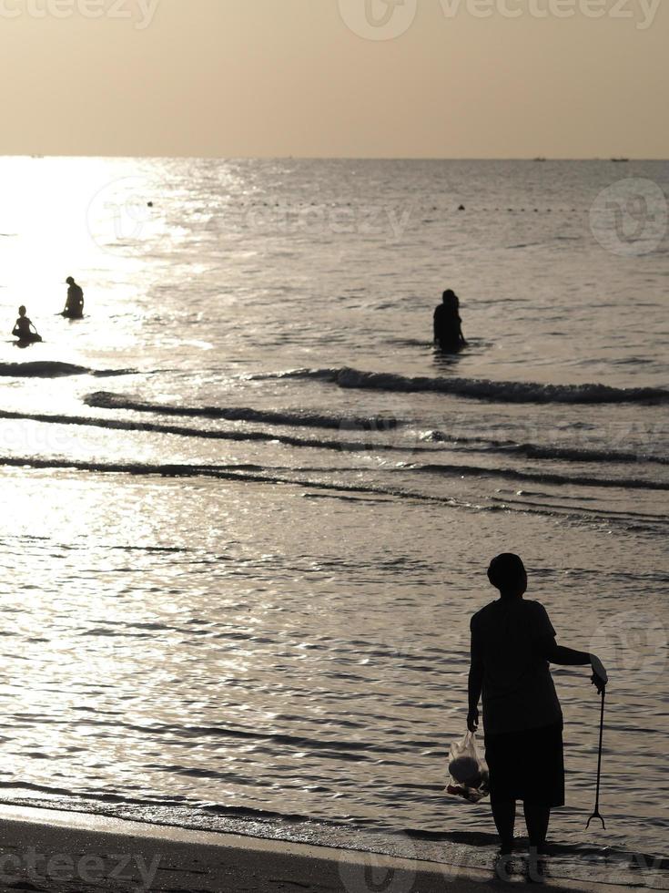 Silhouette peple on the beach photo