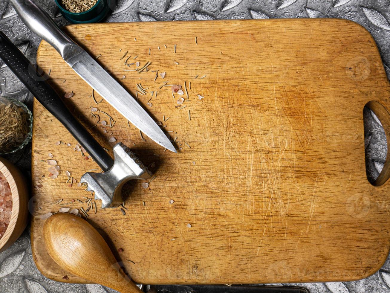 wooden chopping board  and kitchen equipment top view for food concept photo