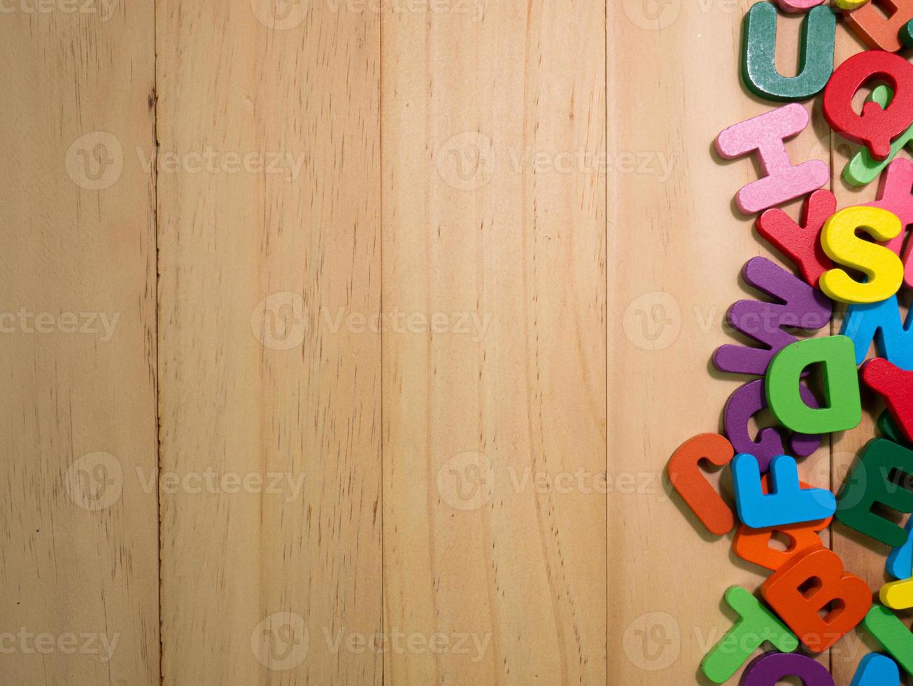 wood alphabet multi color on table for education or kid concept photo