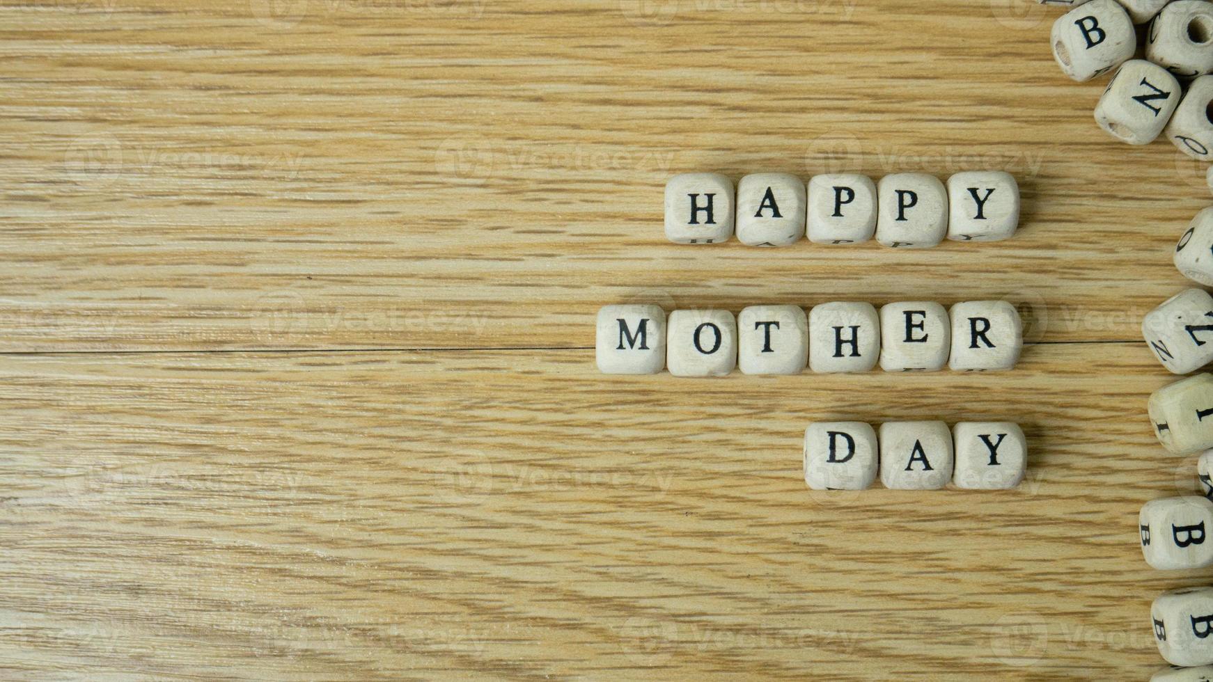 The wood cube word happy mother day for holiday concept photo