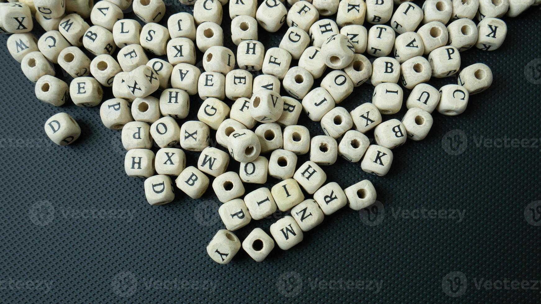 The alphabet wood cube on black background  for  education concept photo
