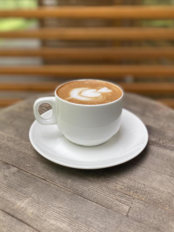 Hot coffee cup on table photo