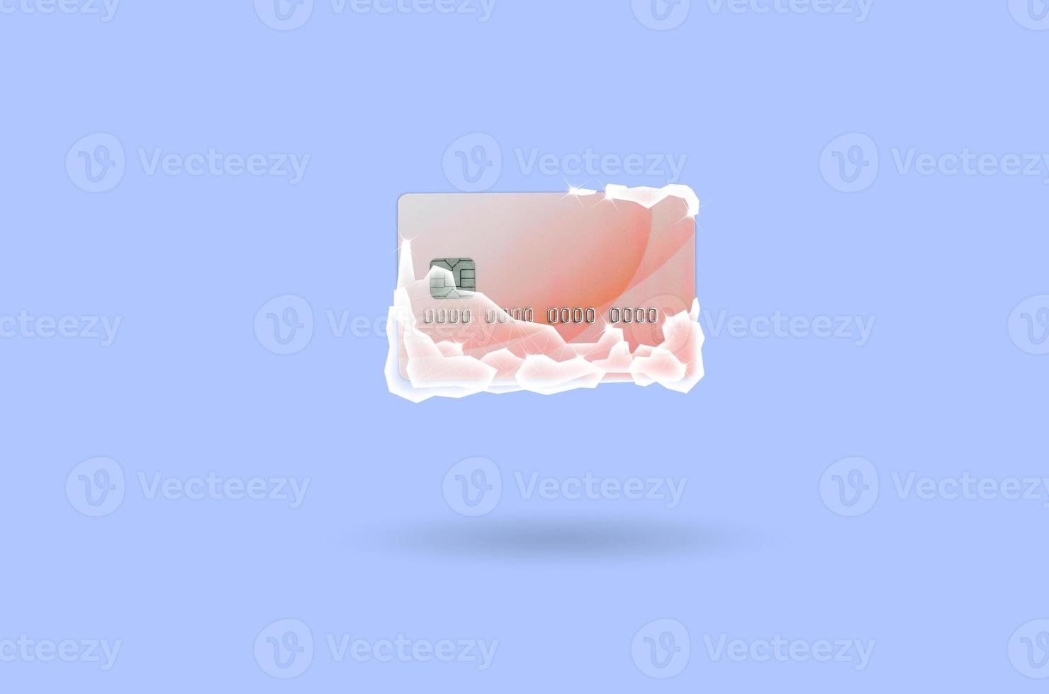 Frozen red credit card in white ice blocks photo