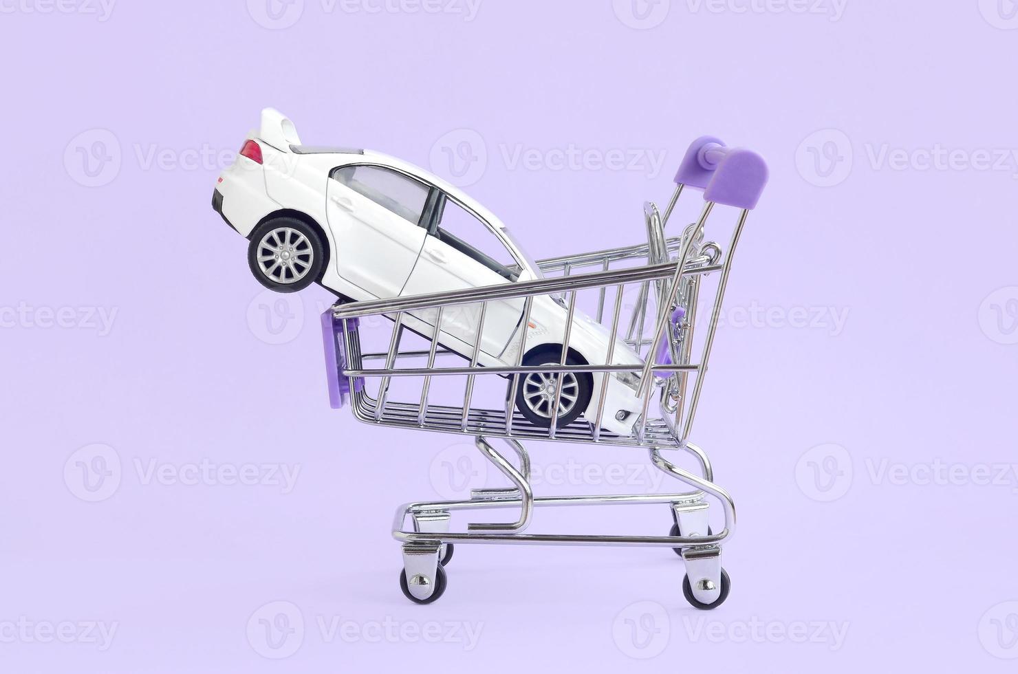 Car buying and leasing concept. Vehicle in shopping cart photo