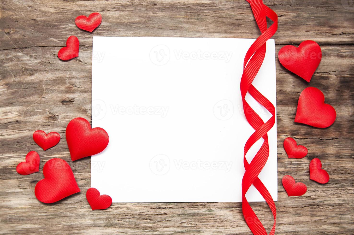 Greeting card with red hearts photo