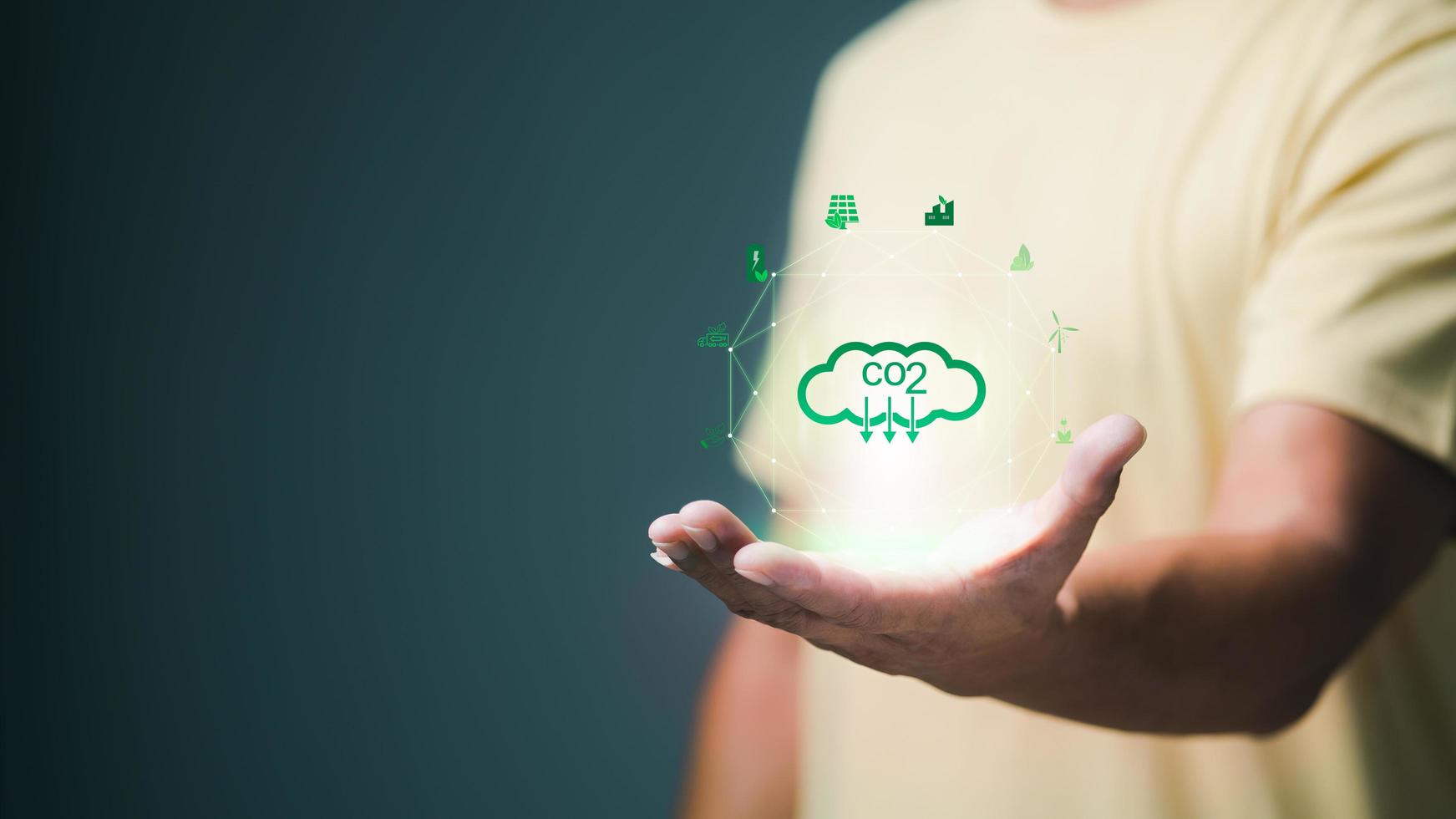 Businessman showing co2 icon in hand, environmental and ecological mitigation concept, global industry executives have to make agreements and change sustainable emissions. because it is an emergency photo