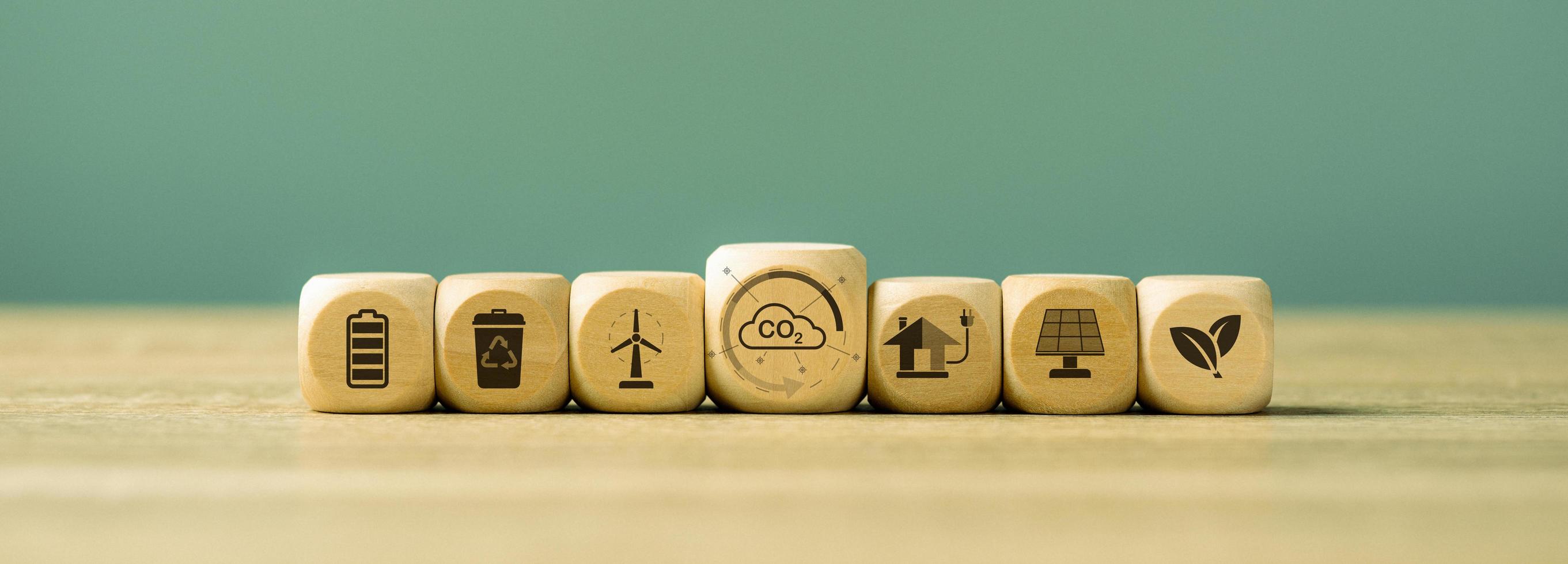 Industrial emissions pollute the environment and ecology. including climate change ,Carbon Reduction Agreement from Renewable Energy Reduce greenhouse gas emissions,wooden cubes arranged on the table photo