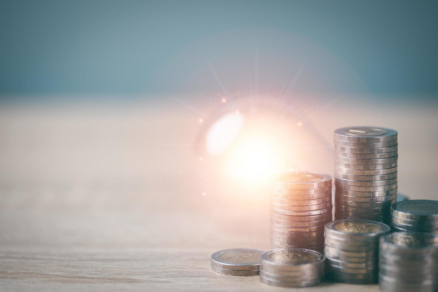 Finance and Investment Growth Ideas Focused on saving money and managing and planning income from the profit of the business, the coins piled up on the table. photo