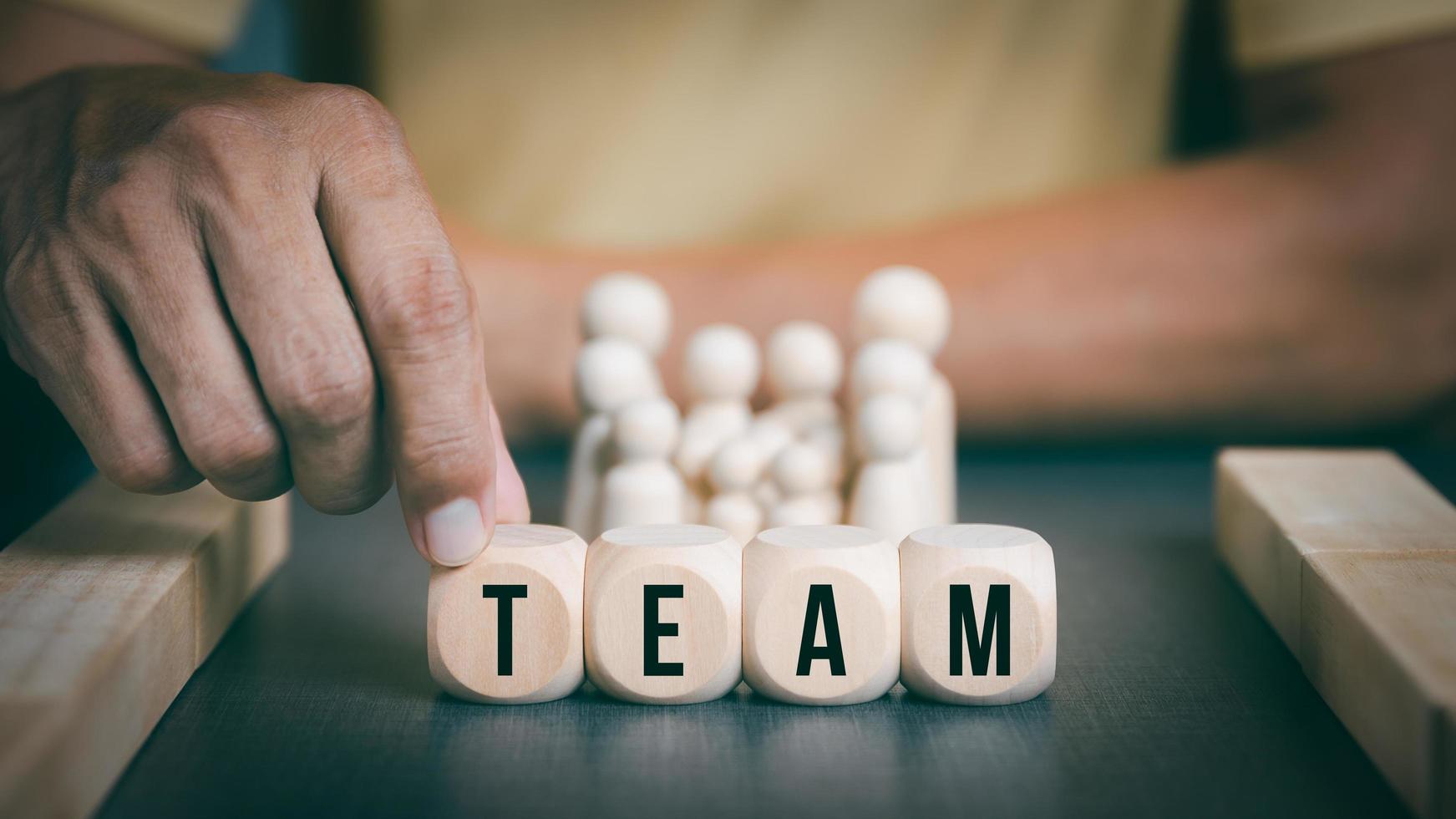 Businessman holding hands on wooden blocks, concept of cooperation teamwork Colleagues, friendship, unity, which is the success strategy of companies and organizations. to new innovation photo