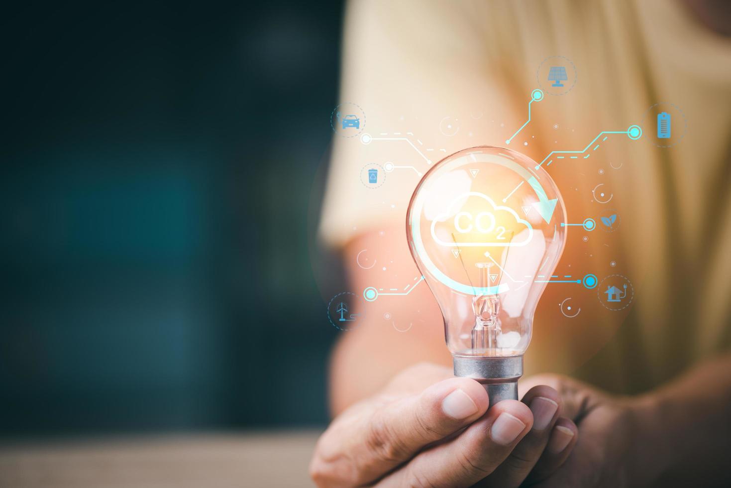 Industrial emissions pollute the environment and ecology. including climate change ,Carbon Reduction Agreement from Renewable Energy Reduce greenhouse gas emissions,man holding a light bulb photo