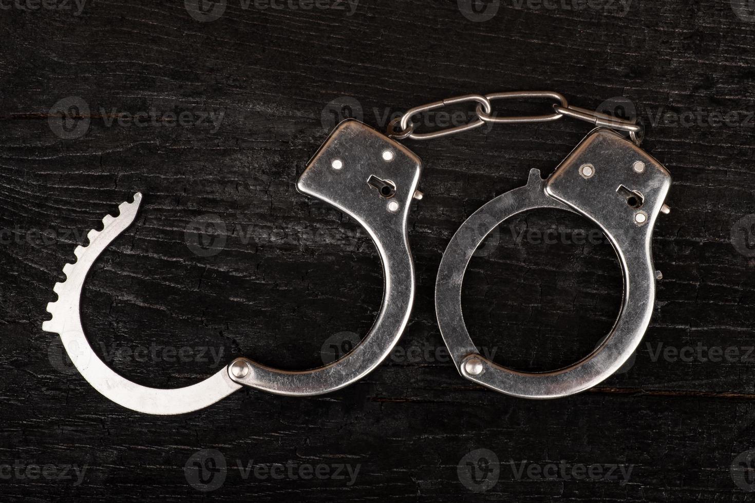 open handcuffs closeup punishment for a crime photo