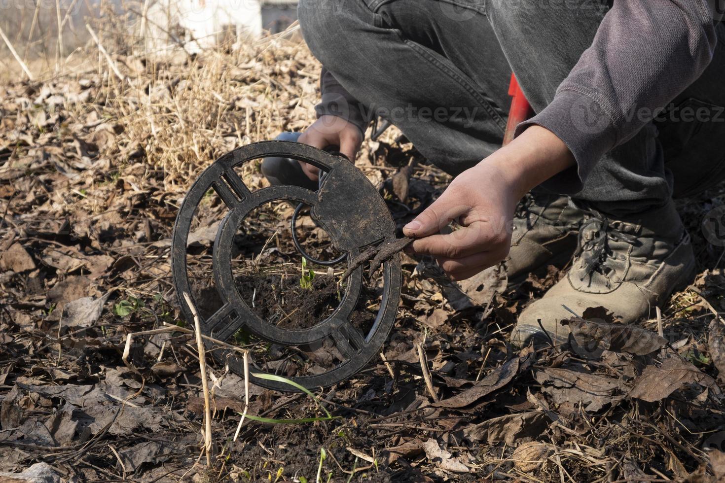 search for military things from the times of the Austrian war with a metal detector photo