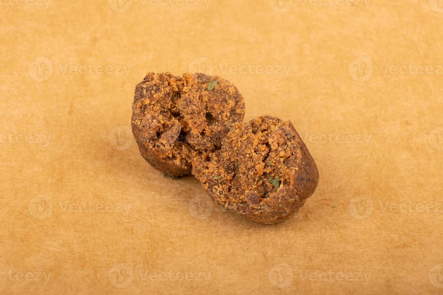brown pieces of hashish on a yellow background, cannabis wax photo