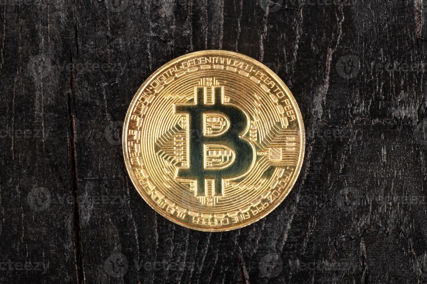 bitcoin coin on a dark background closeup photo