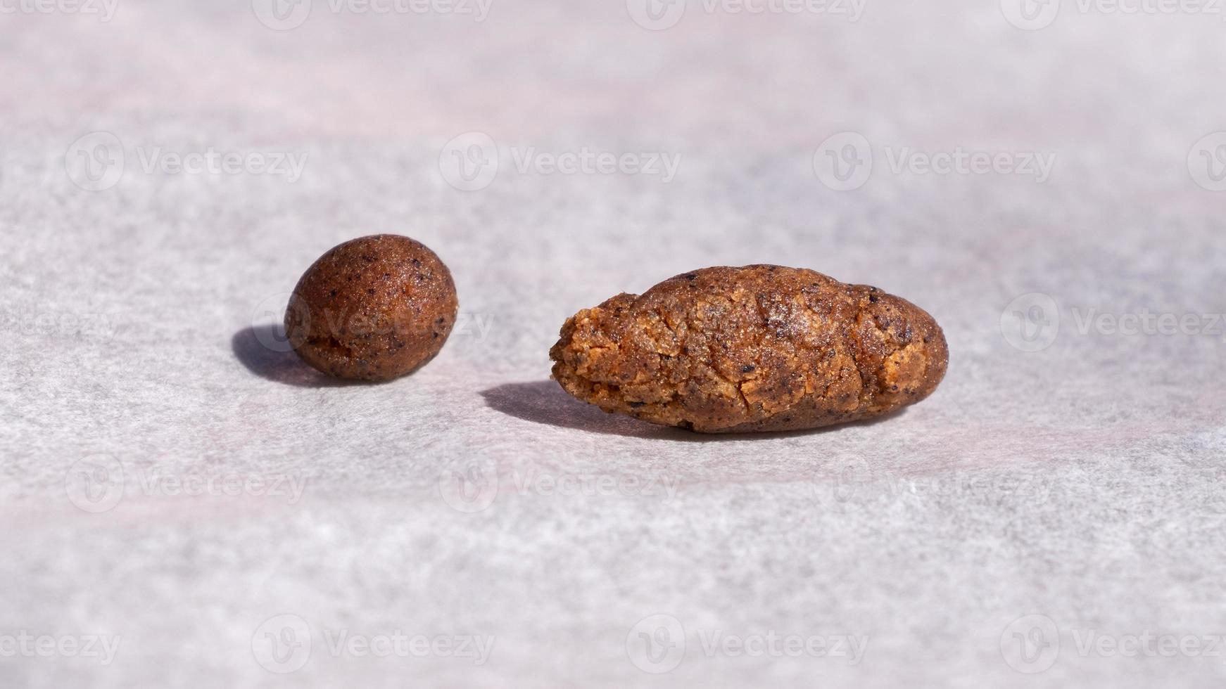 brown pieces of hashish on paper, cannabis trichomes photo