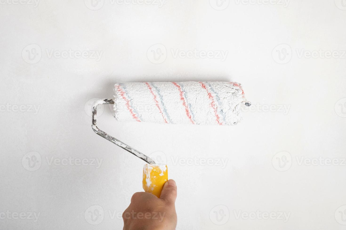 paint roller for painting walls, house renovation concept photo