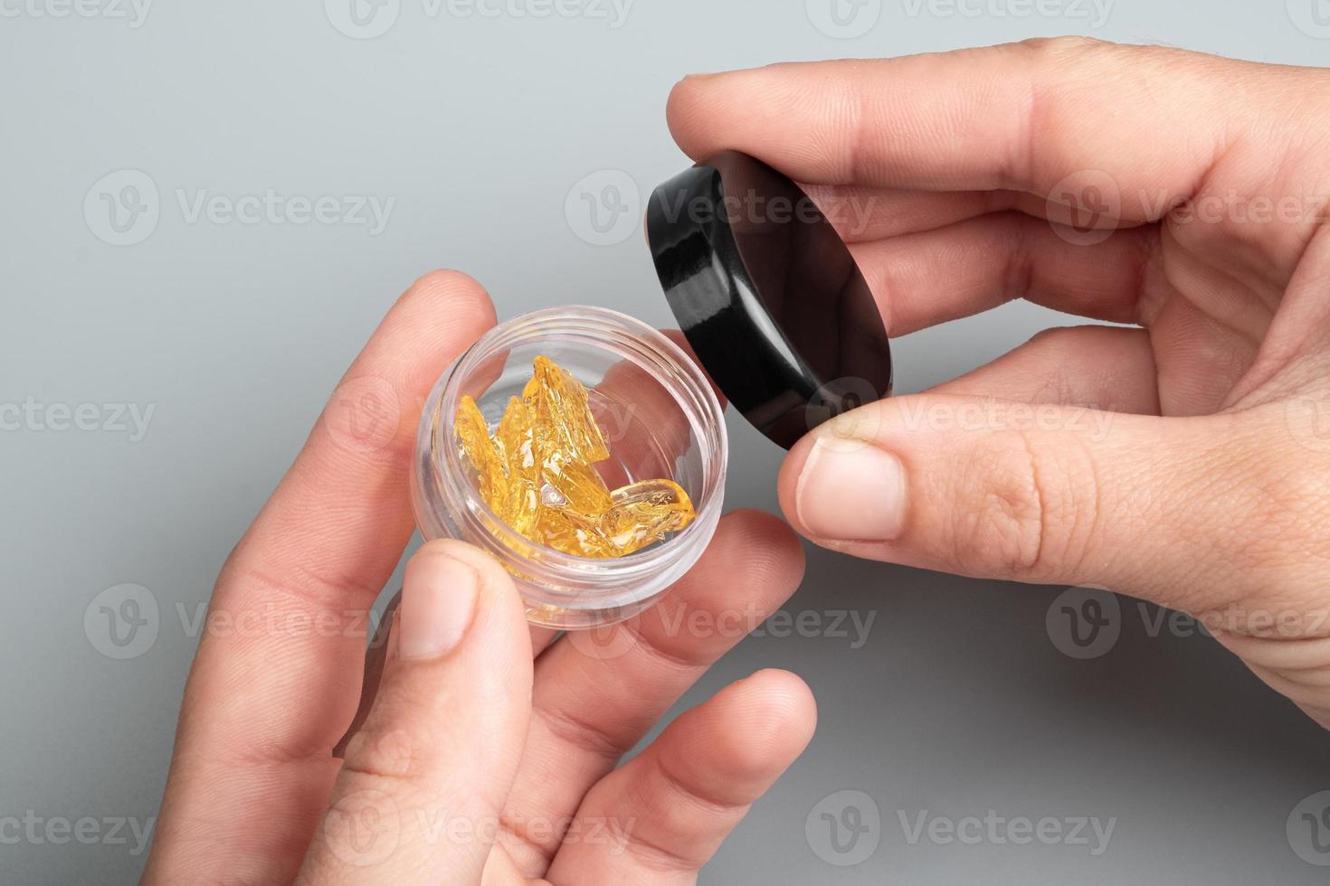 golden cannabis resin in a box, wax with high thc photo