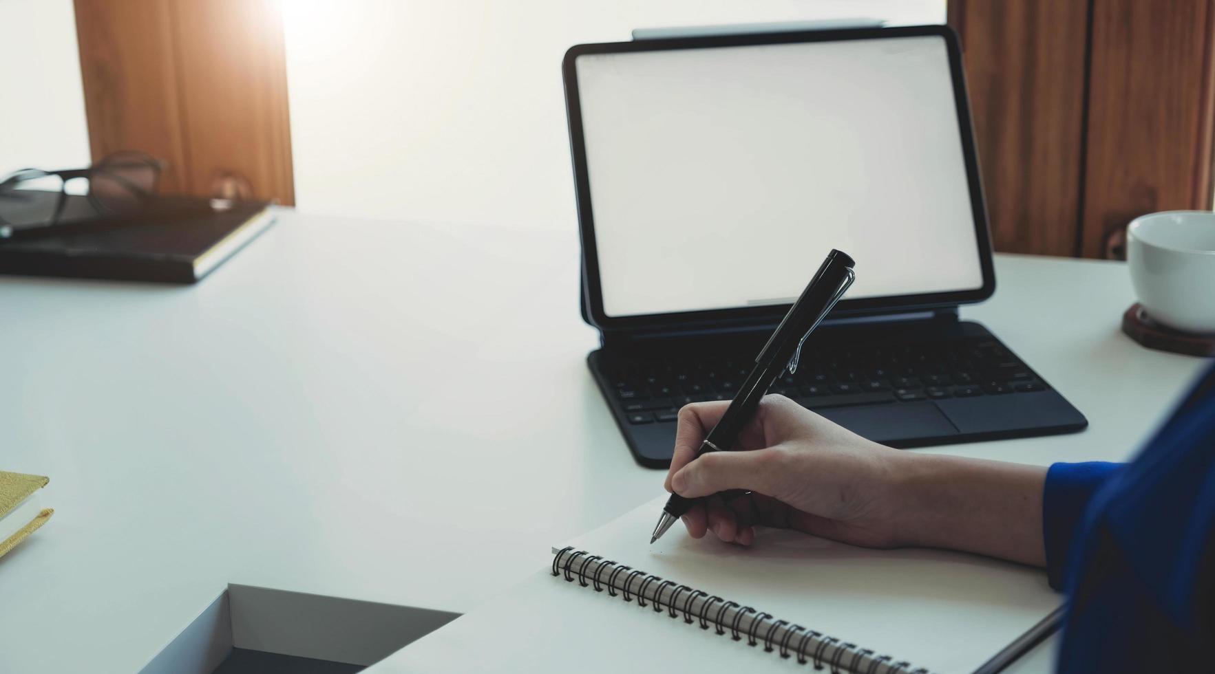 Picture of woman hand filling in invoice paper,Online Taxes And Invoice Billing Electronic Management. photo