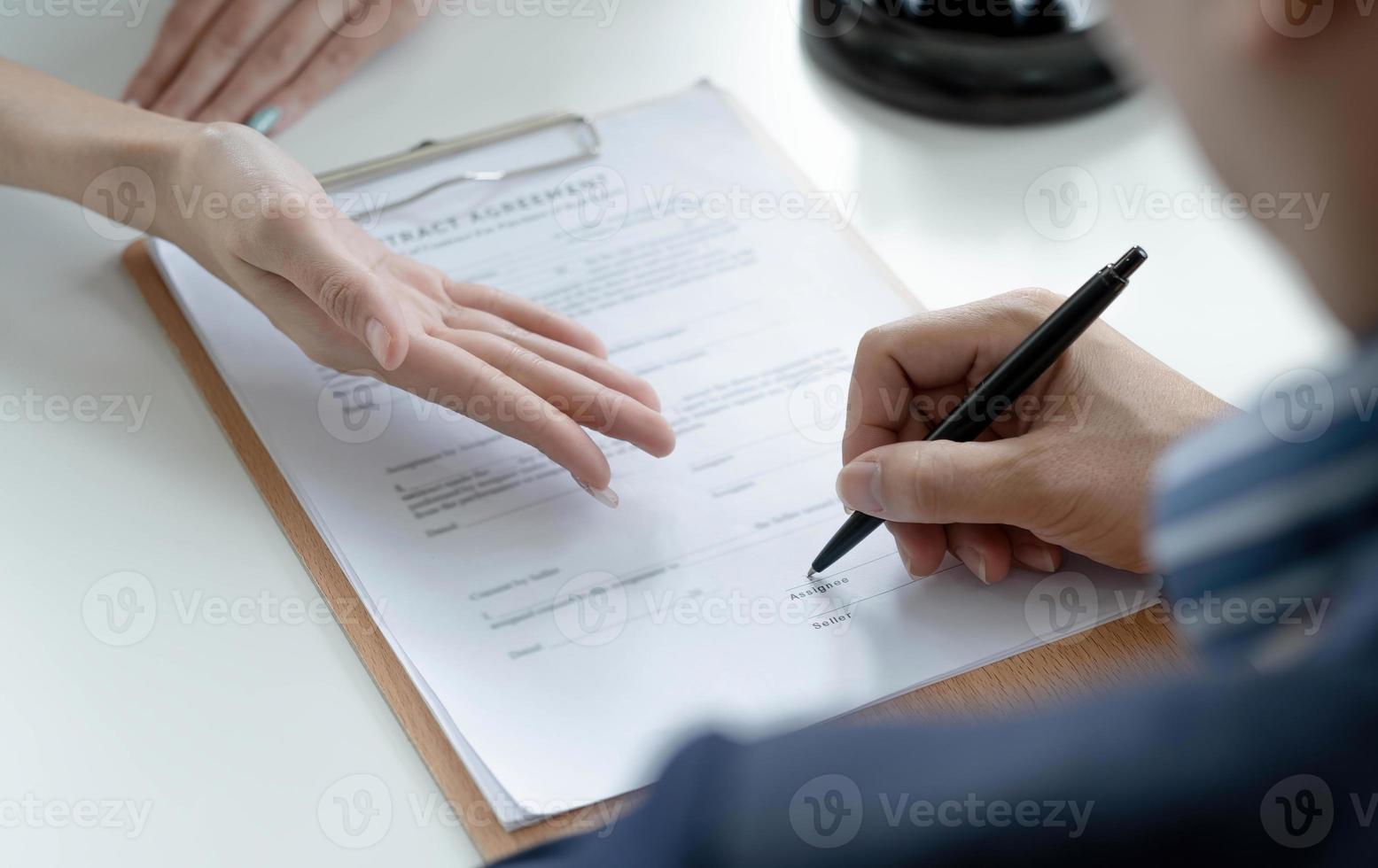 The hard work of an asian lawyer in a lawyer's office. Counseling and giving advice and prosecutions about the invasion of space between private and government officials to find a fair settlement. photo