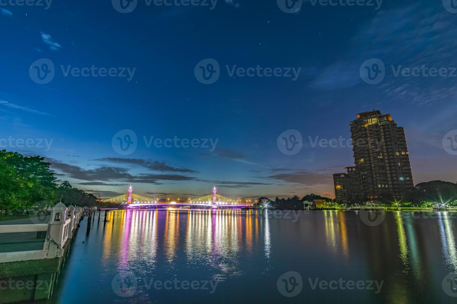 Bridge over the Chao Phraya River, turn on the LED lights at dusk. photo