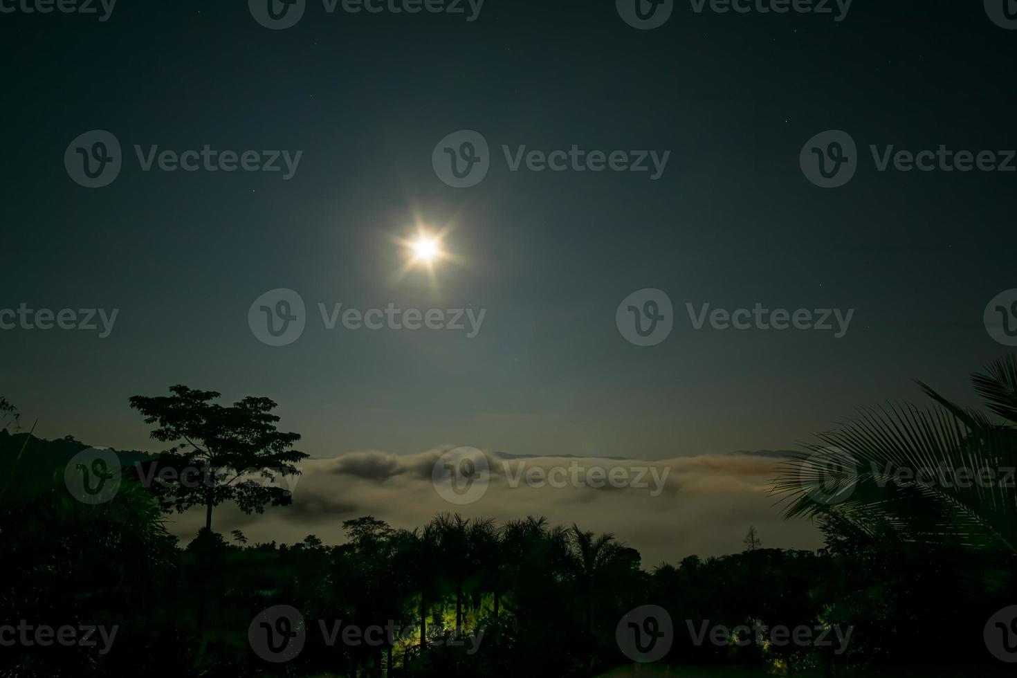 Full moon reflecting bright light  The time before sunrise photo