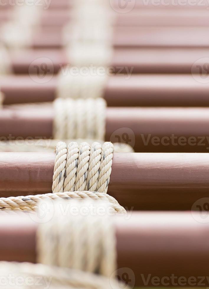 Rope knot around metal pipe photo