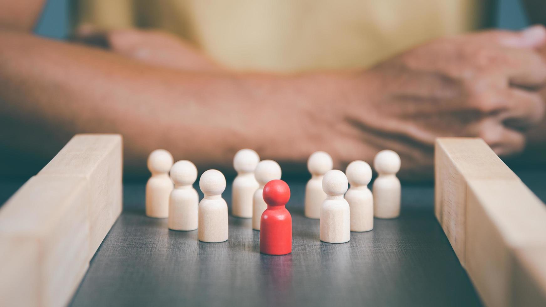 wooden blocks lined up behind businessmen The concept of teamwork and business strategy by managing and developing it step by step The competition is planned based on professional marketing data. photo