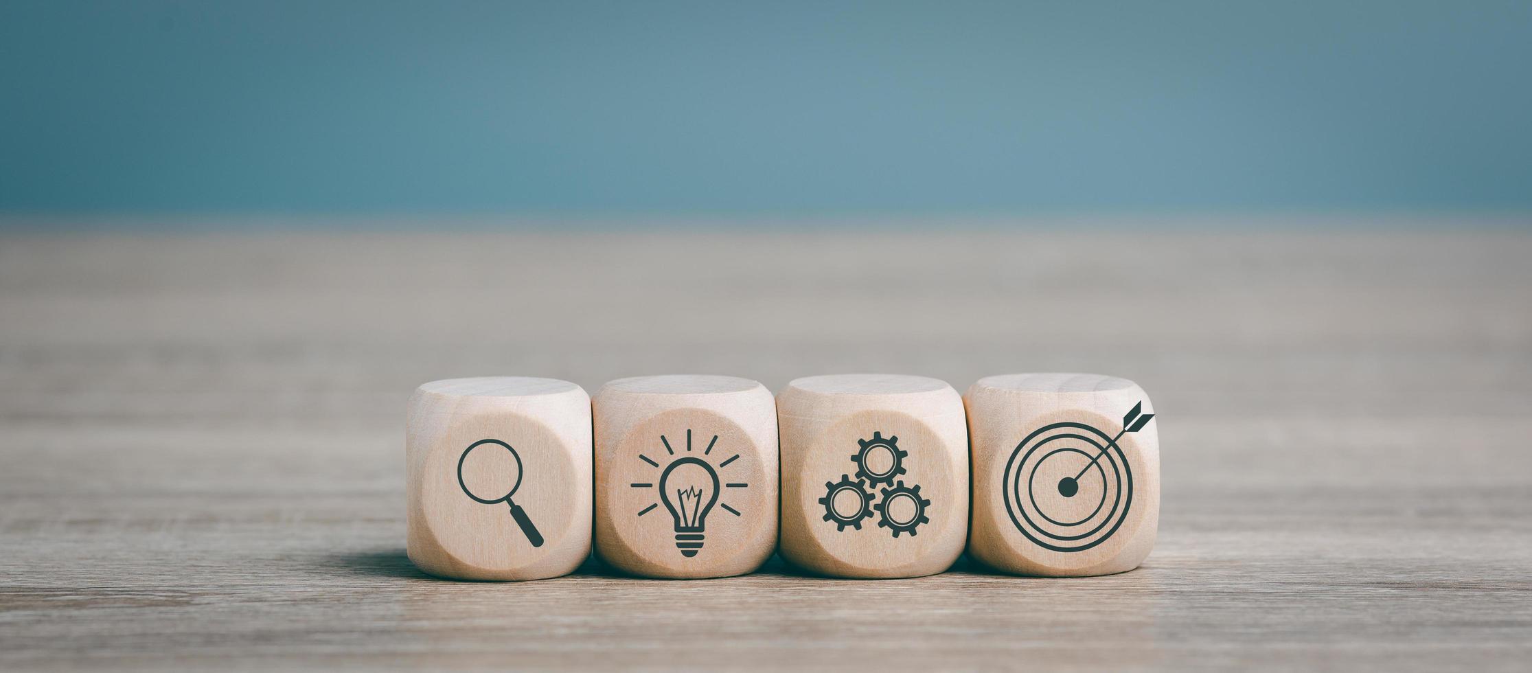 Wooden blocks lined up on a desk, goal setting idea. and business strategy through planning and teamwork To analyze and develop the company's performance from growth to future data. photo