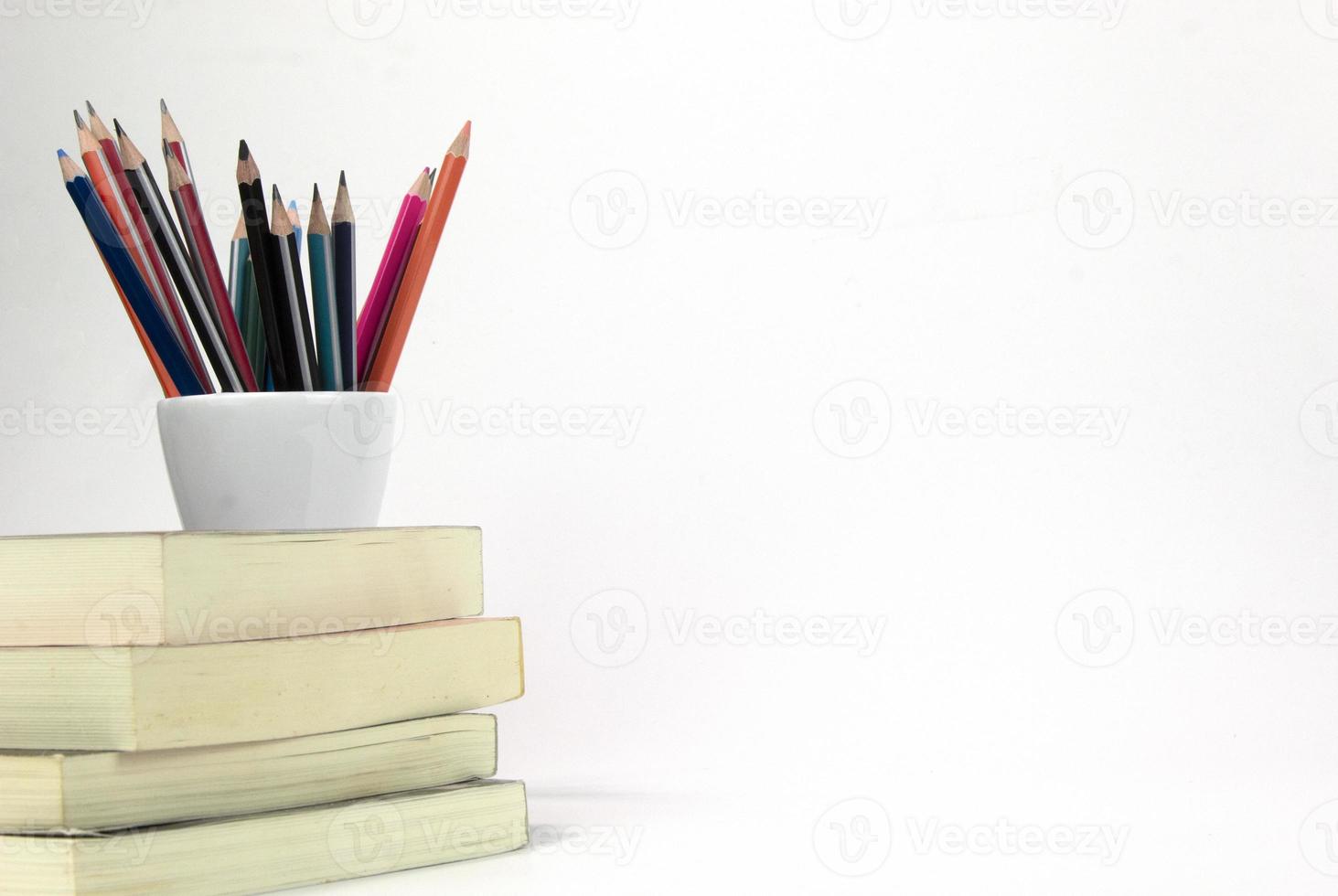 Education materials in the box and books isolated on white background. Back to school poaster concept template design photo