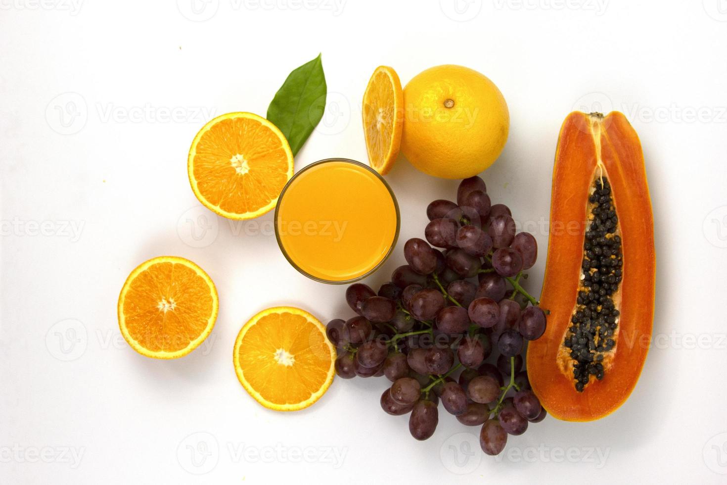 Group of Orange juice in glass isolated on white background, fresh orange juice drink with grapes and leaf, healthy drink in summer concept photo