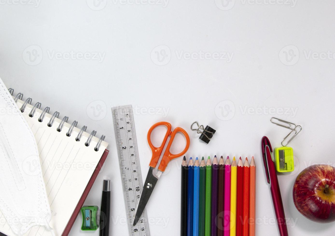 Set of Education elements concepts, color pencils, face mask, paper clips, scissors, ruler  isolated on white background. Back to school concept print ads design photo