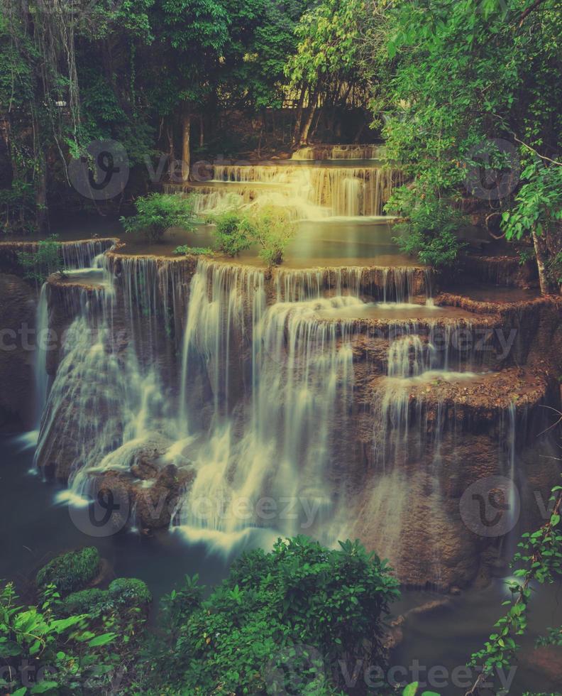 Tropical rainforest waterfall in Thailand. Retro filtered color image photo